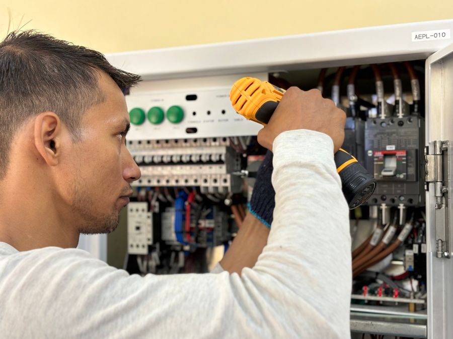 Electrician working on a panel