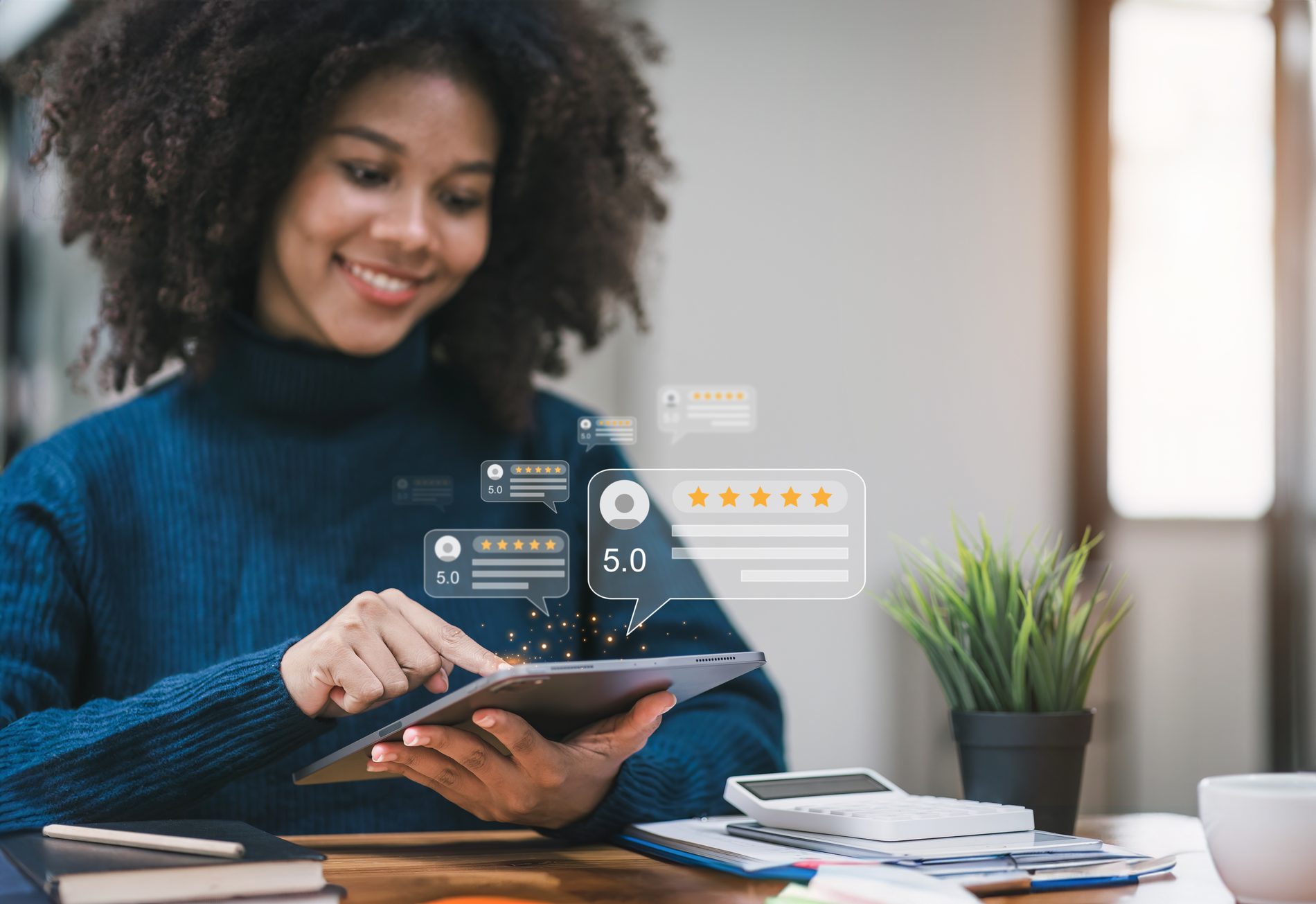 Tablet showing five-star online customer reviews